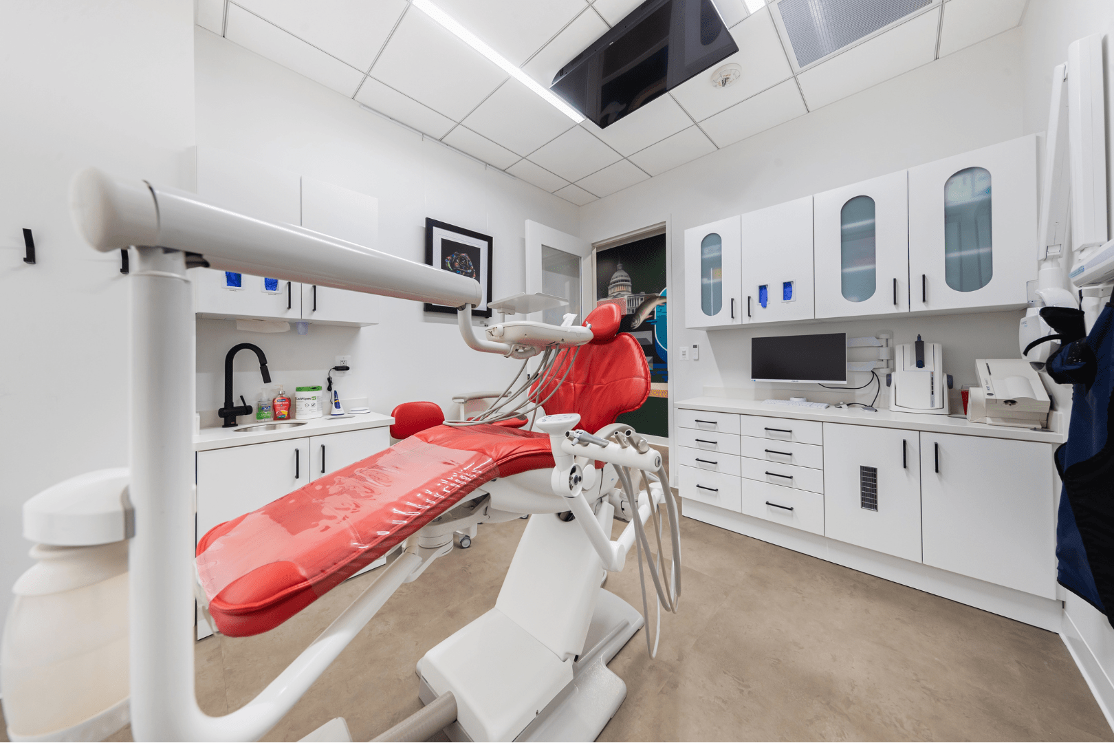 Techne Dental operatory with red dental chair