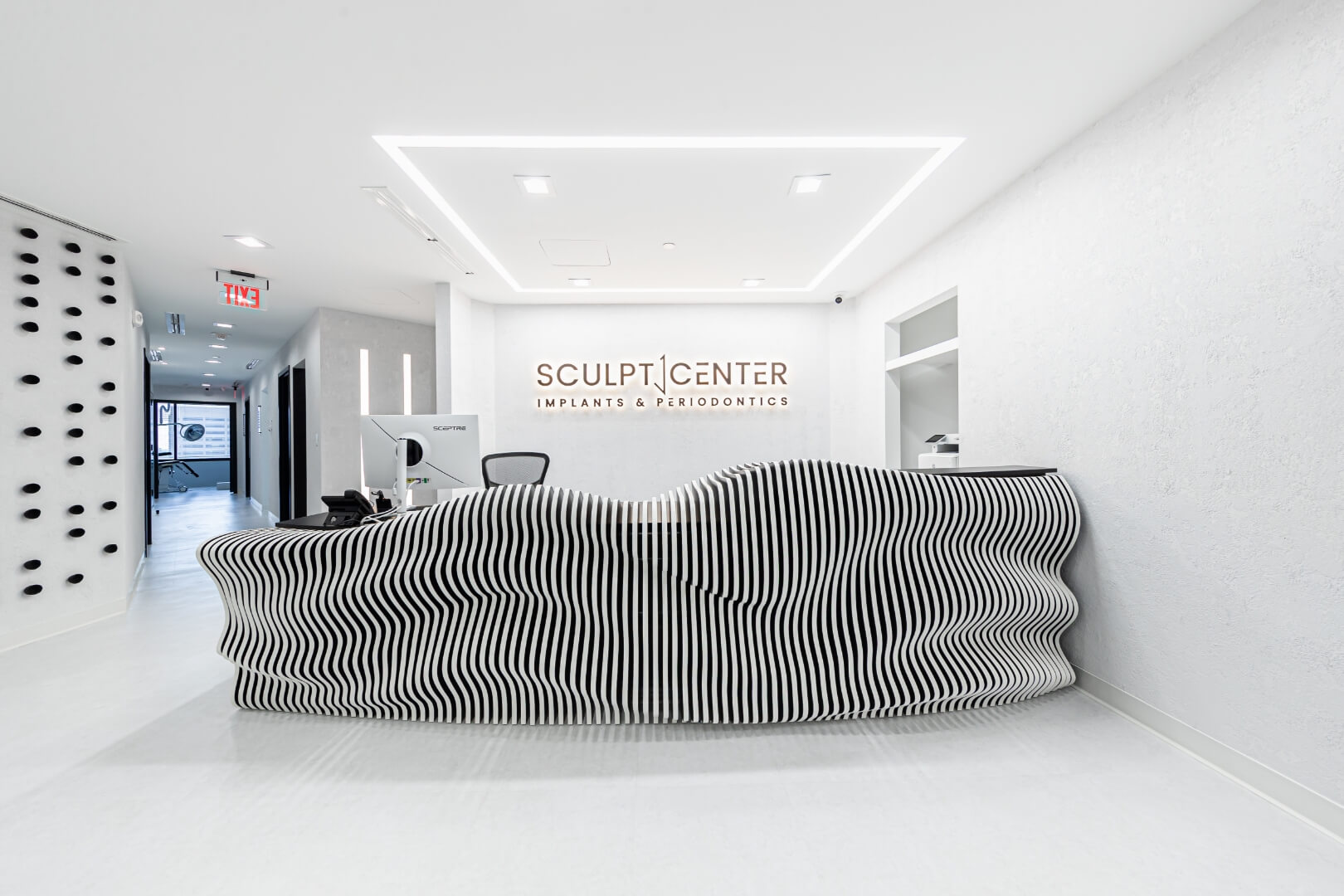 View of modern textured front desk of Sculpt Center