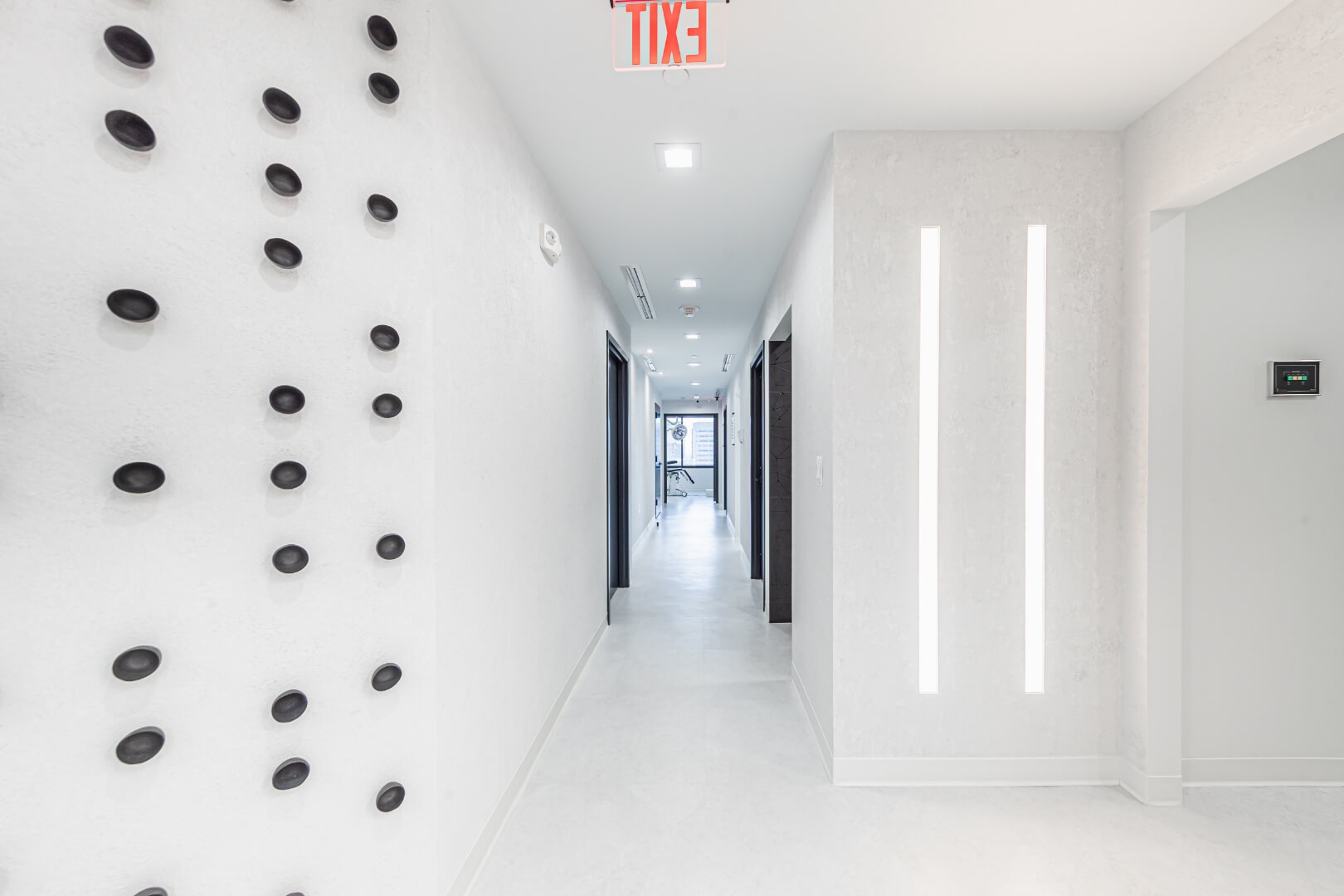 Minimalist hallway view leading toward patient rooms